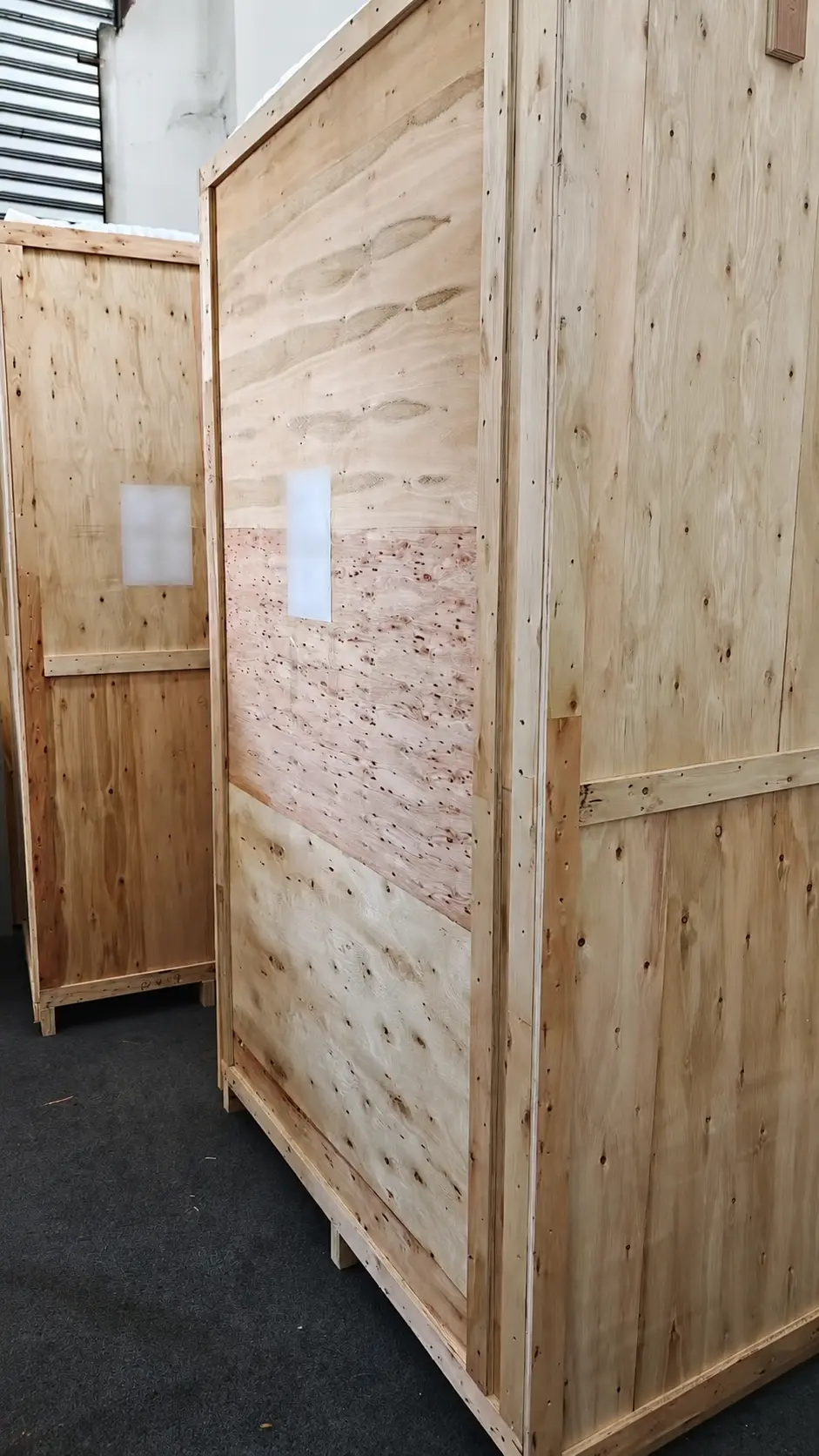 Multiple protective wooden crates prepared for transport