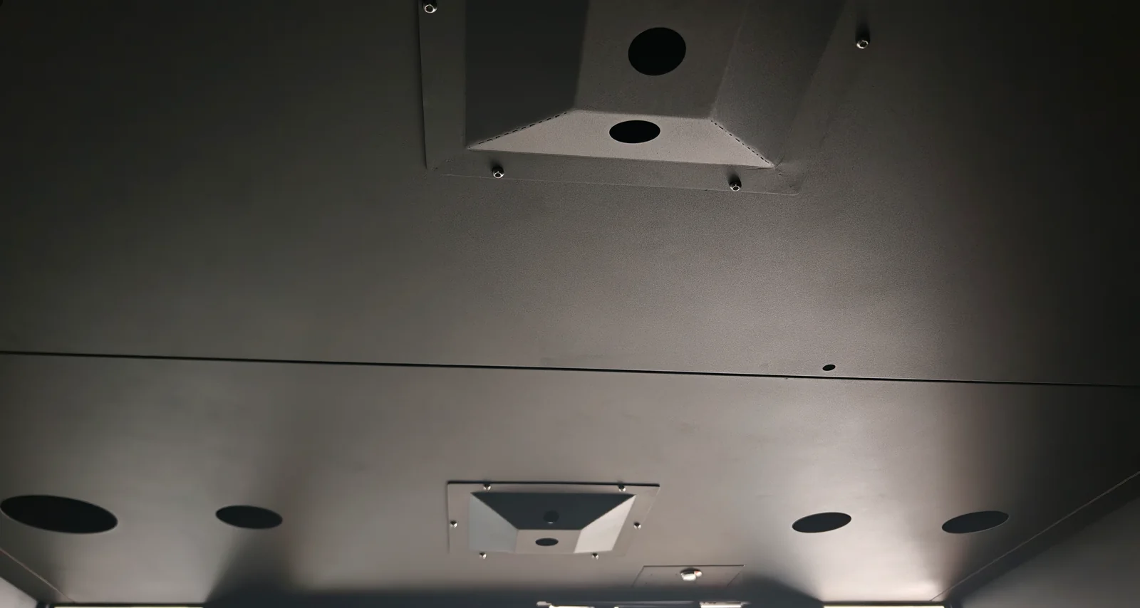 Factory view of customer-specified ceiling openings before equipment installation
