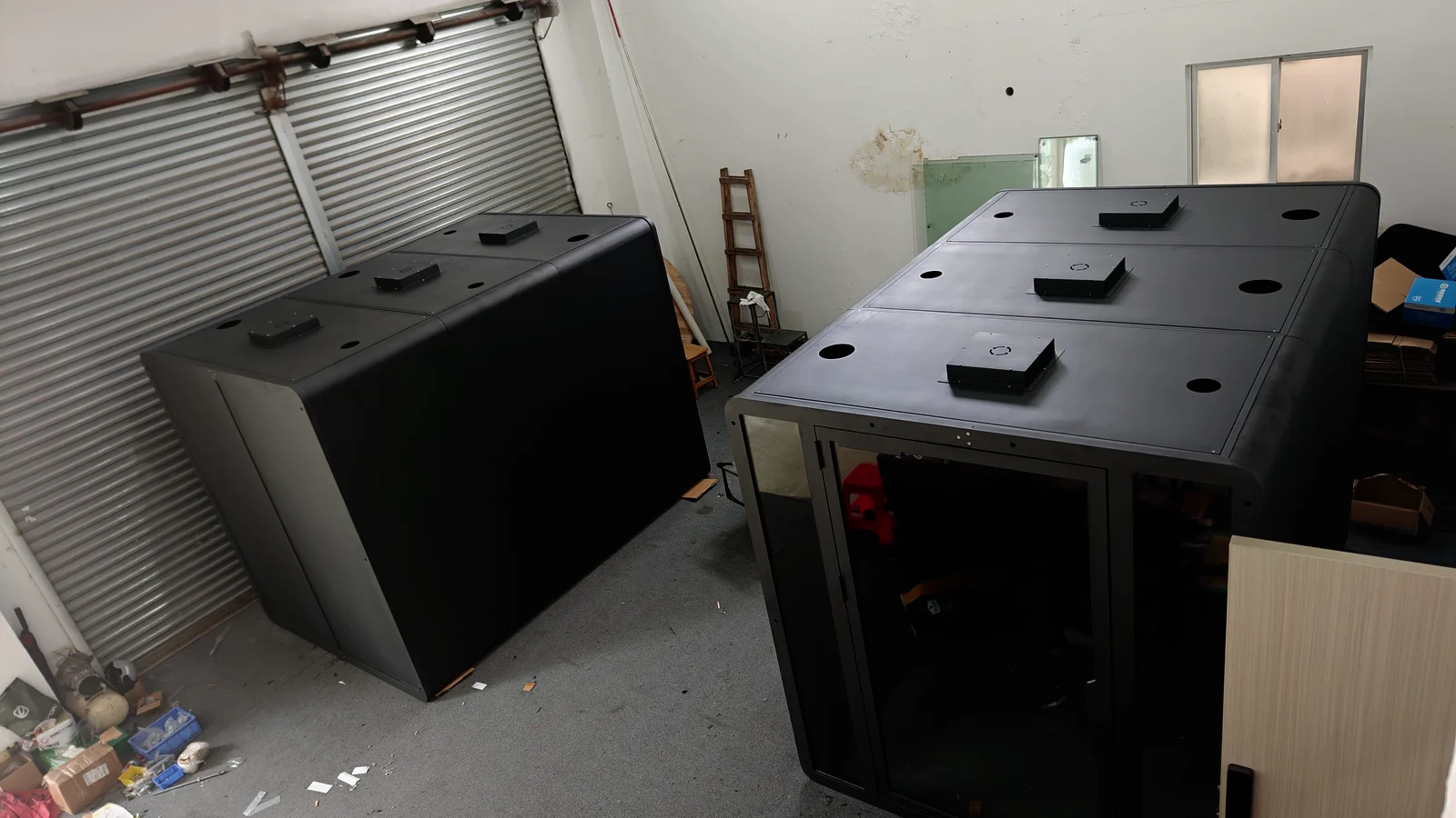 Three custom acoustic pod shells during factory assembly for a Japan project